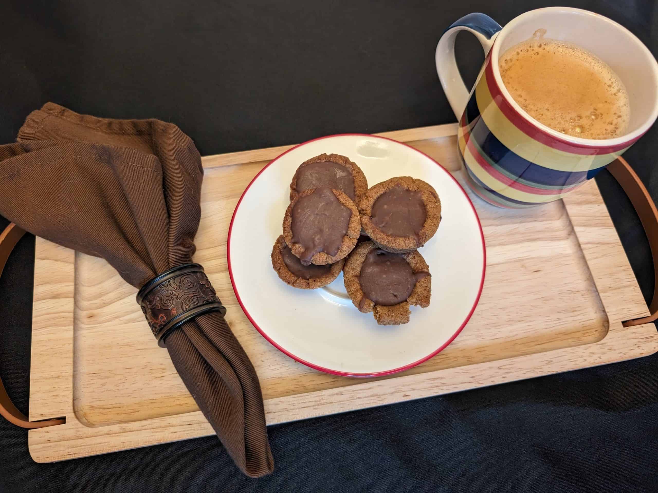 Keto Irish Cream Cookie Cups plated next to coffee