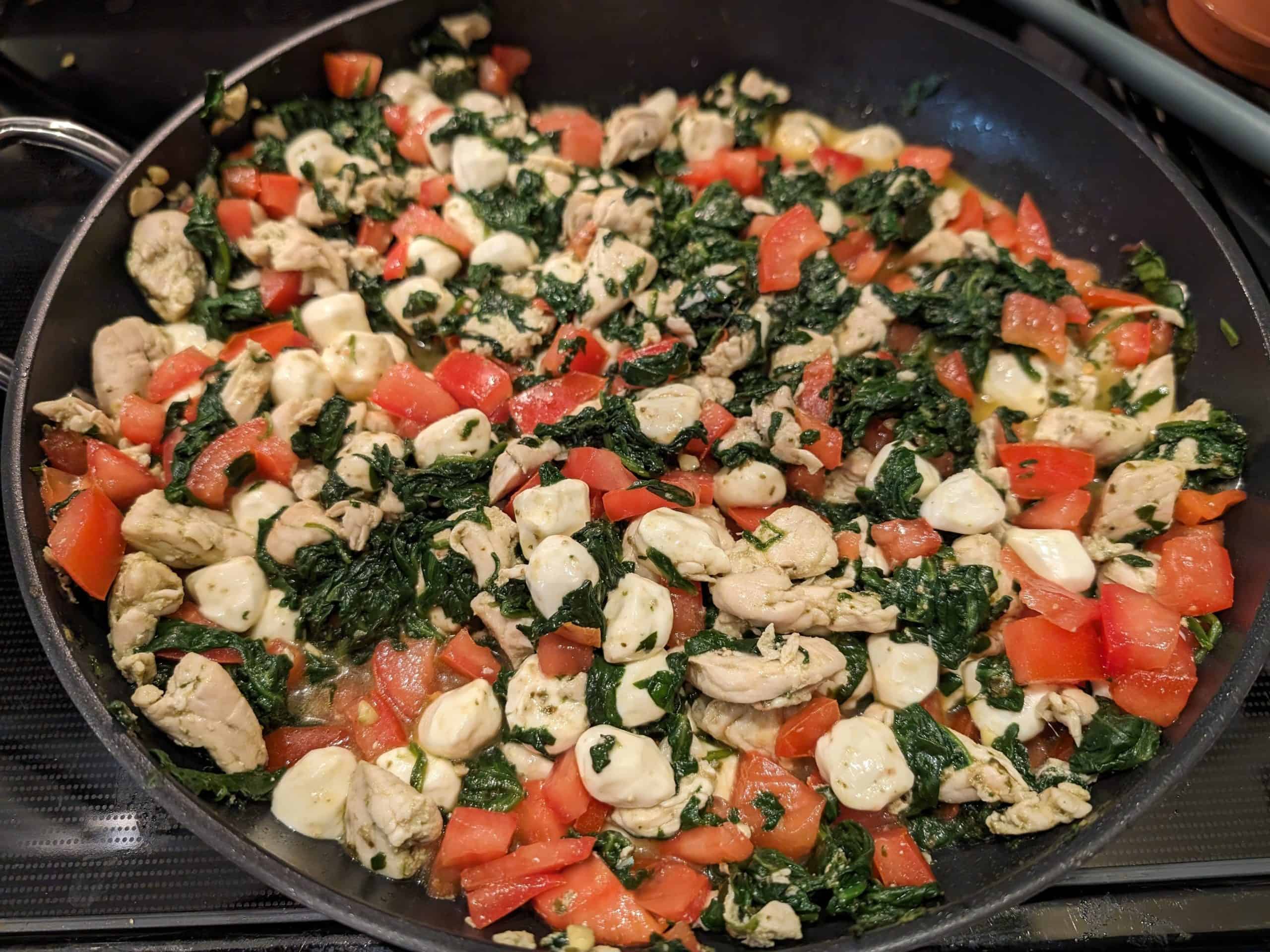 Caprese Chicken Spinach Skillet in a pan