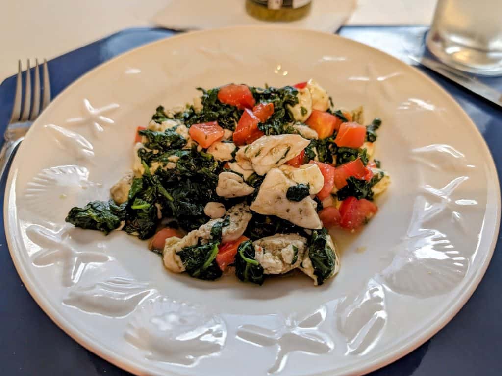 Caprese Chicken Spinach Skillet plated in a white bowl