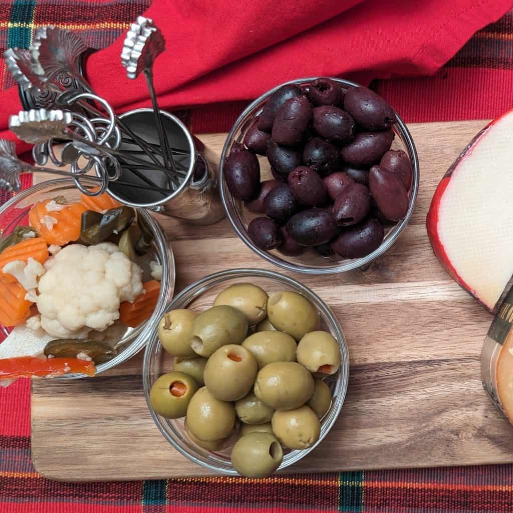 Easy appetizers of giardiniera and olives with cocktail picks