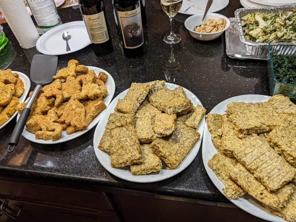 Buffet set up with dino chicken patties and ranch cauliflower chia cakes