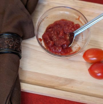 Easy Sweet and Sour Tomato Jam in a small bowl ready to serve