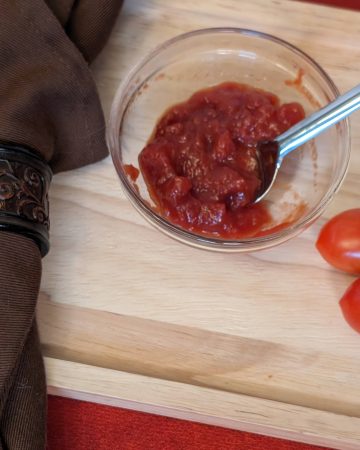 Easy Sweet and Sour Tomato Jam in a small bowl ready to serve
