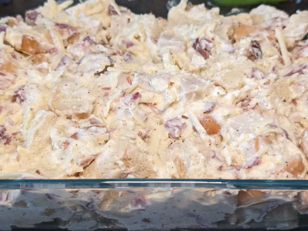 Keto Chicken Ham and Cheese Stuffing ready to bake in casserole dish side view