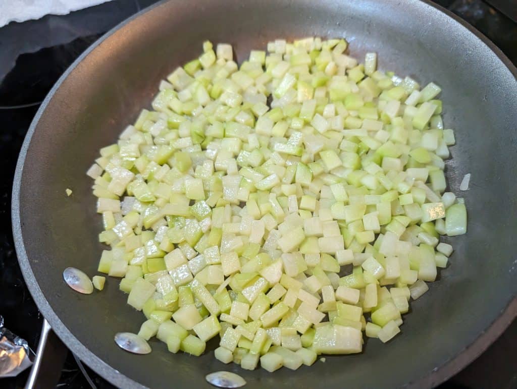 Chayote squash diced and in pan being cooked