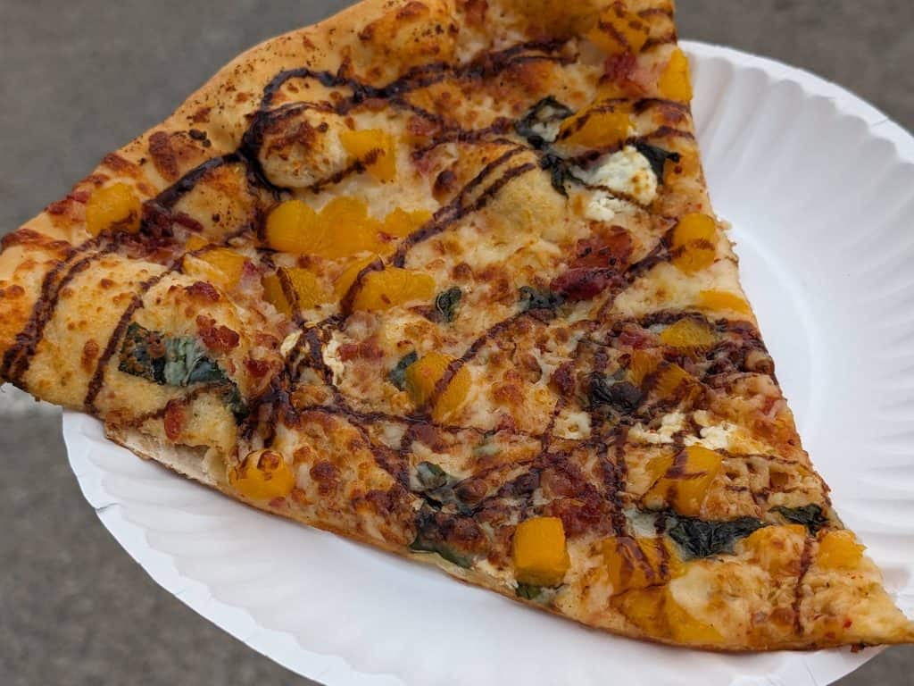 Slice of "Eat A Peach" Pizza at Sonic Temple 2024