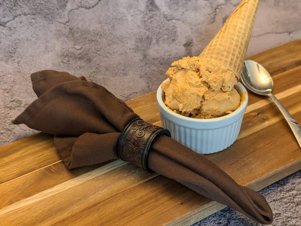 Small ramekin filled with Chipotle Keto Ice Cream with a keto ice cream cone upside down on top of it