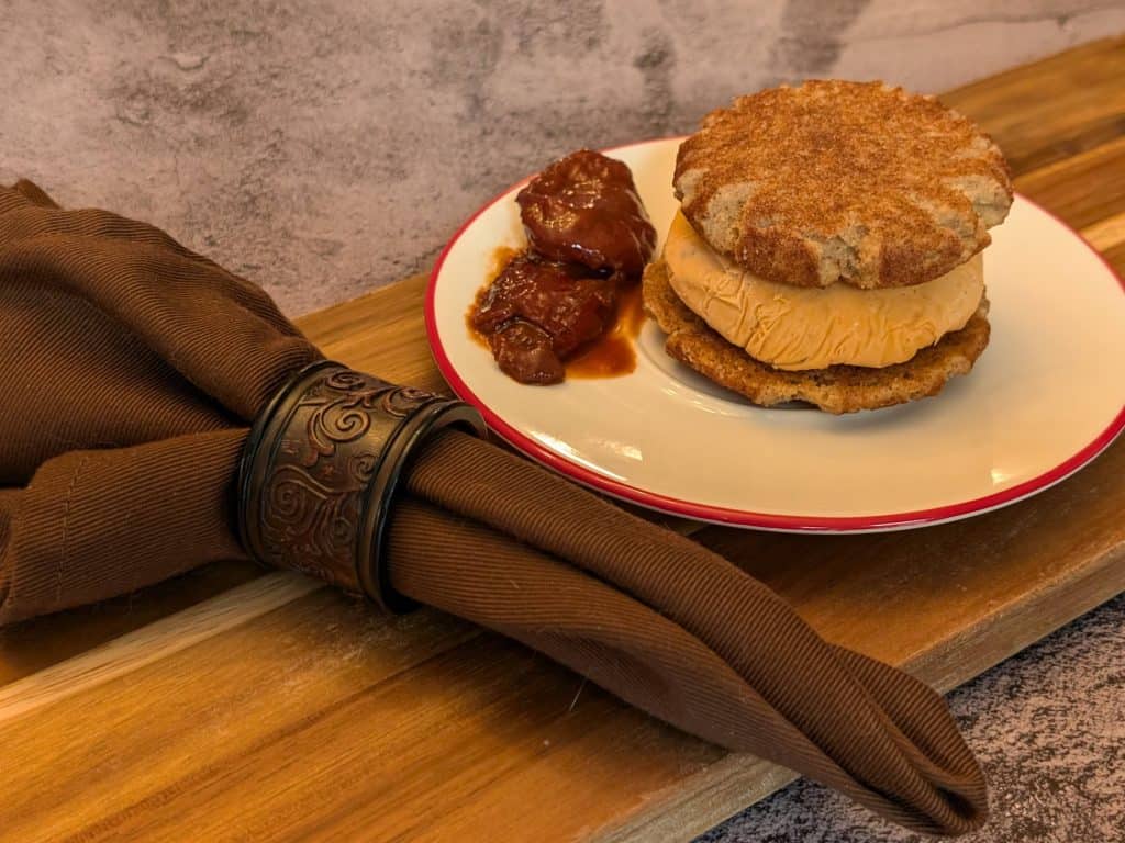 Keto Chipotle Ice Cream Sandwich on a plate with 2 chipotles in adobo sauce, close-up