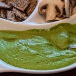 Close up of Garlicky Spinach Cashew Dip in a serving dish