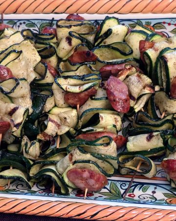 Grilled Zucchini and Andouille Skewers on a serving platter