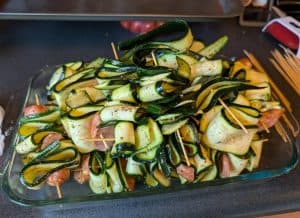 Constructed but uncooked Zucchini and Andouille Skewers ready to grill