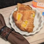 Mango Almond Flour Scones plated next to Mango Sutra Spice Blend packet