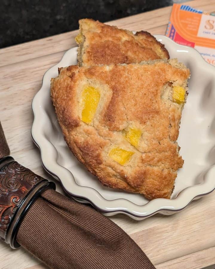 Mango Almond Flour Scones plated next to Mango Sutra Spice Blend packet