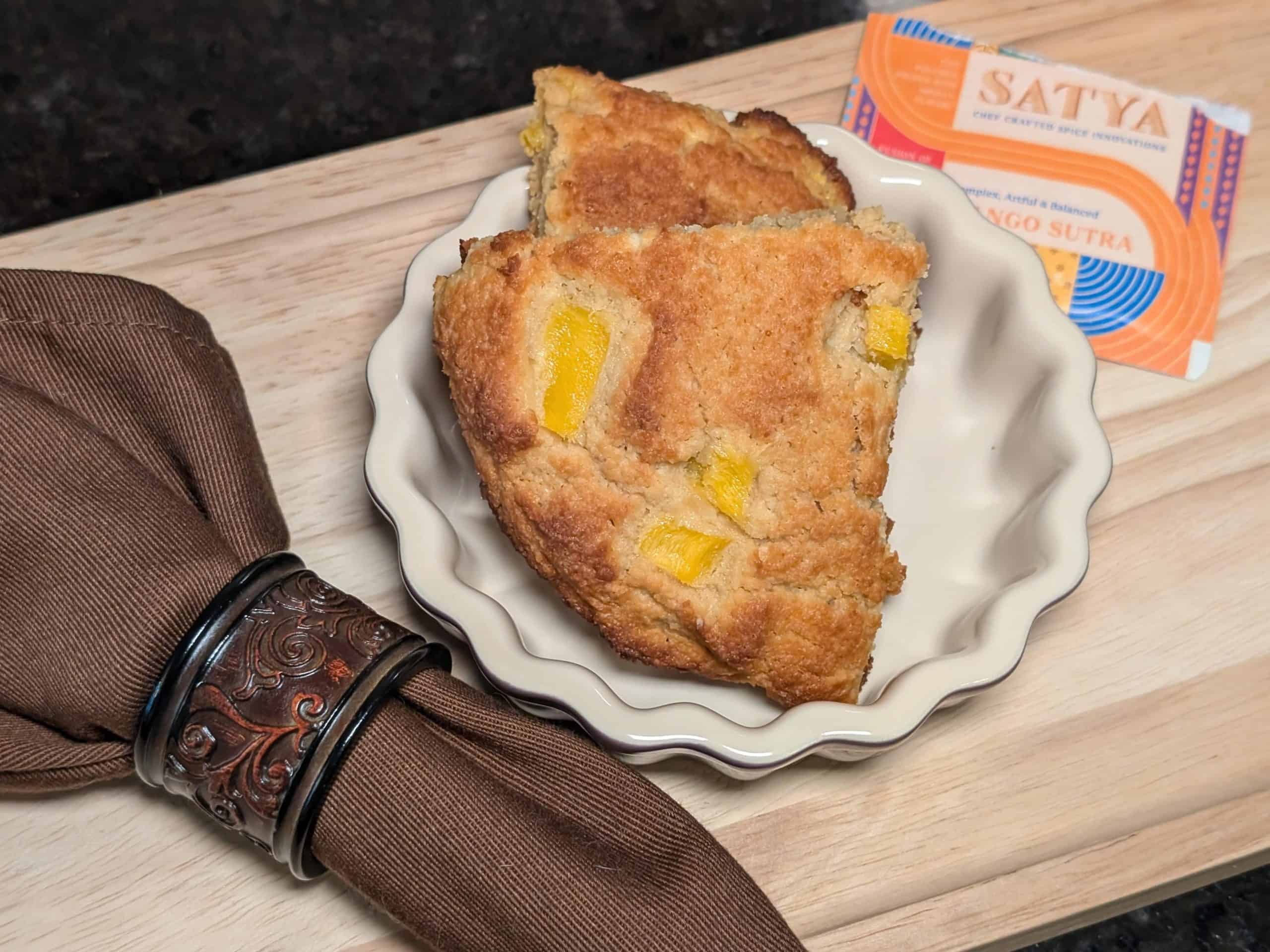 Mango Almond Flour Scones plated next to Mango Sutra Spice Blend packet