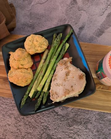 Cilantro Chutney Marinated Tuna Steak on a plate with Easy Roasted Asparagus and Savory Almond Flour Biscuits