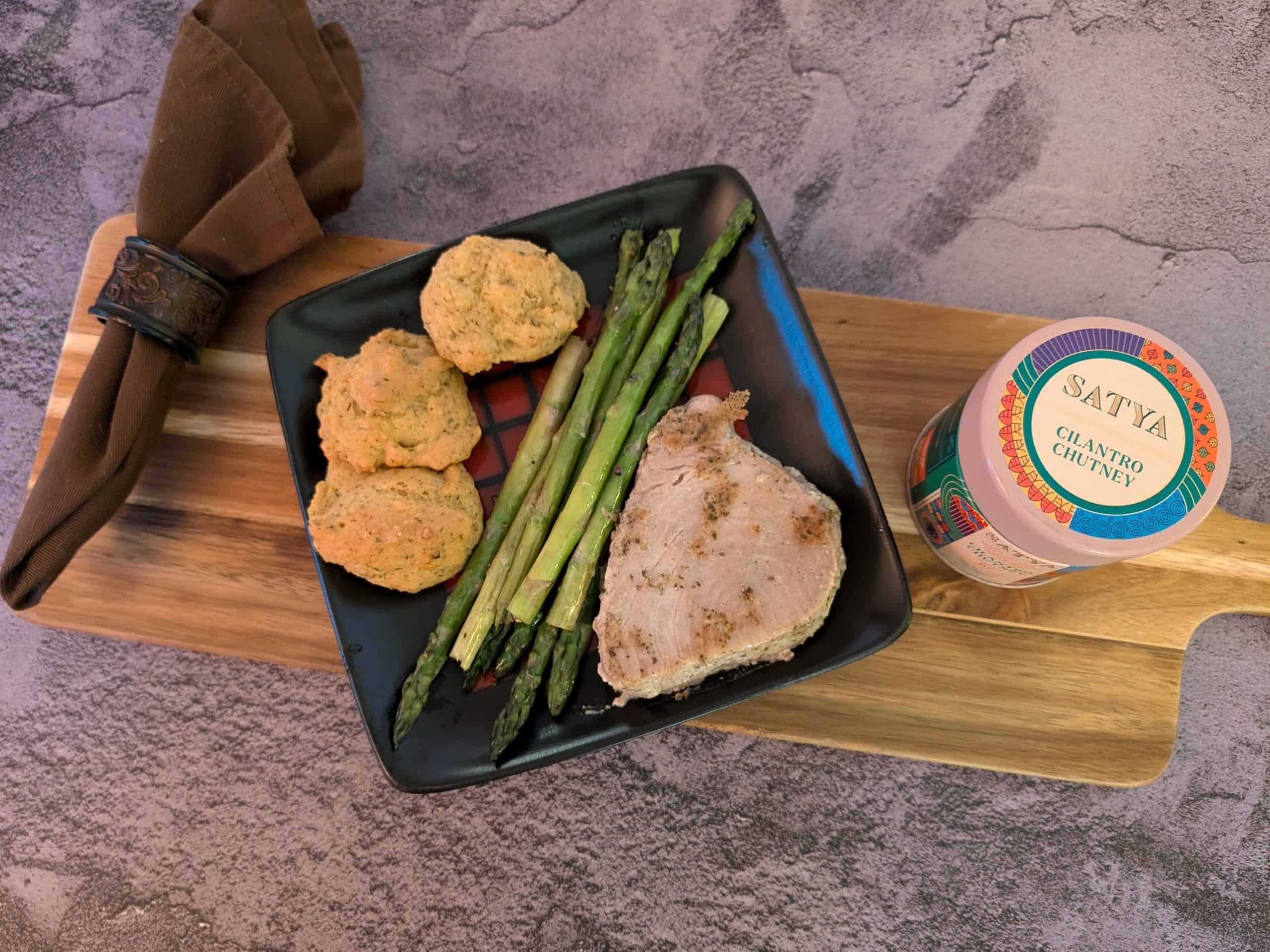 Cilantro Chutney Marinated Tuna Steak on a plate with Easy Roasted Asparagus and Savory Almond Flour Biscuits