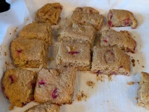 Baked Strawberry Almond Flour Scones separated on a baking sheet