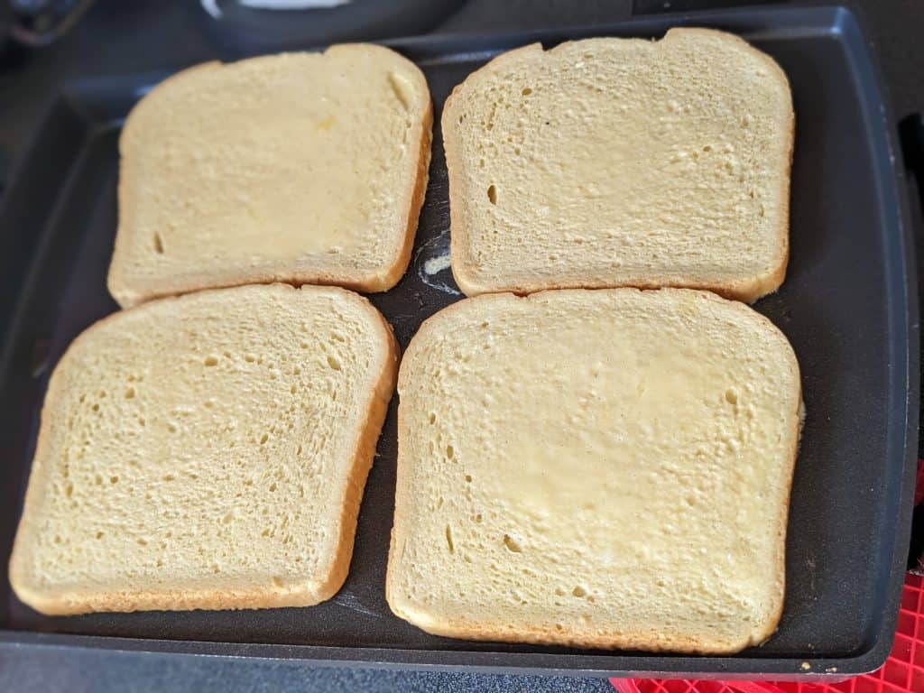 Keto French Toast on the griddle before flipping