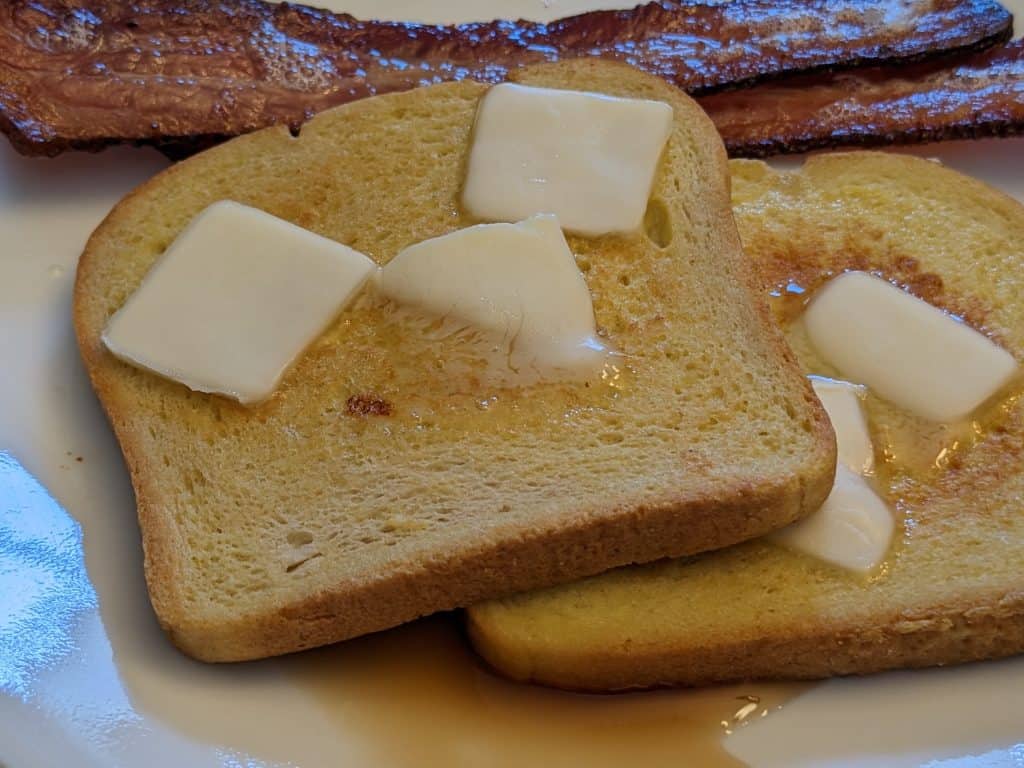 Keto French Toast plated with butter and syrup