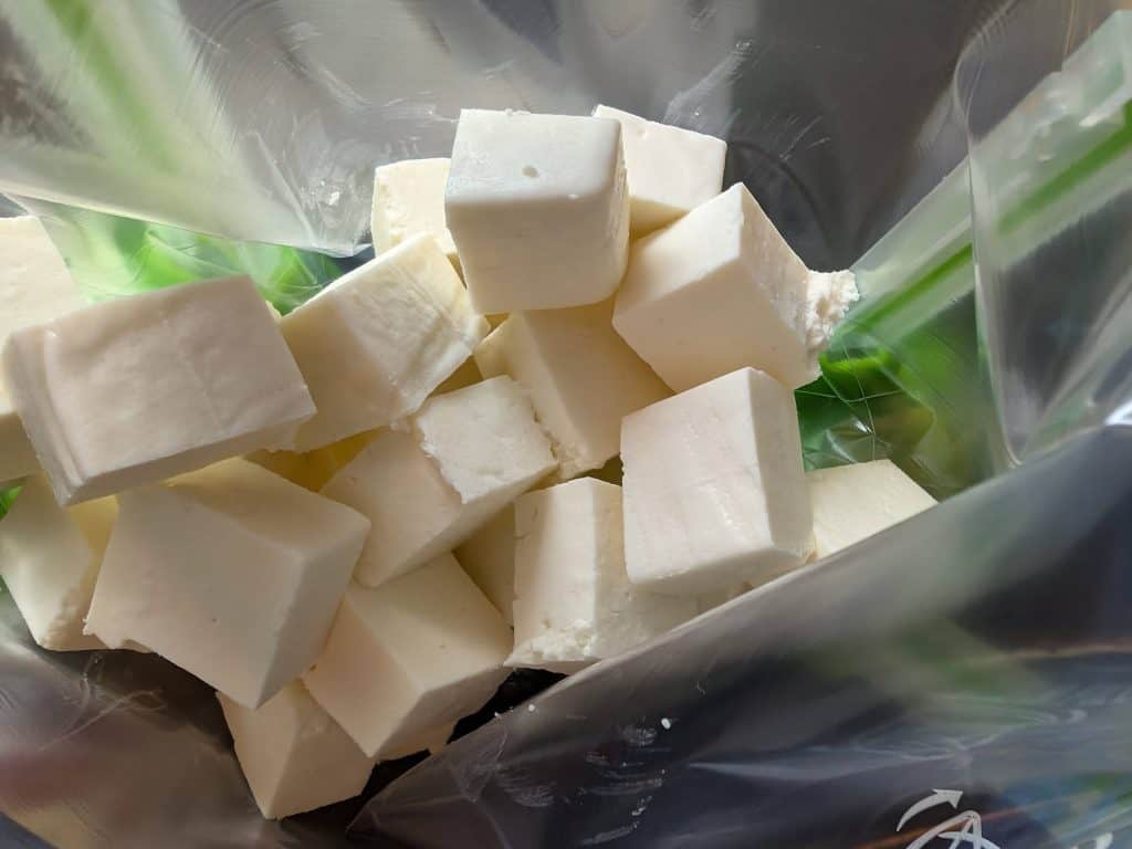 Cubes of Paneer in a zip top bag