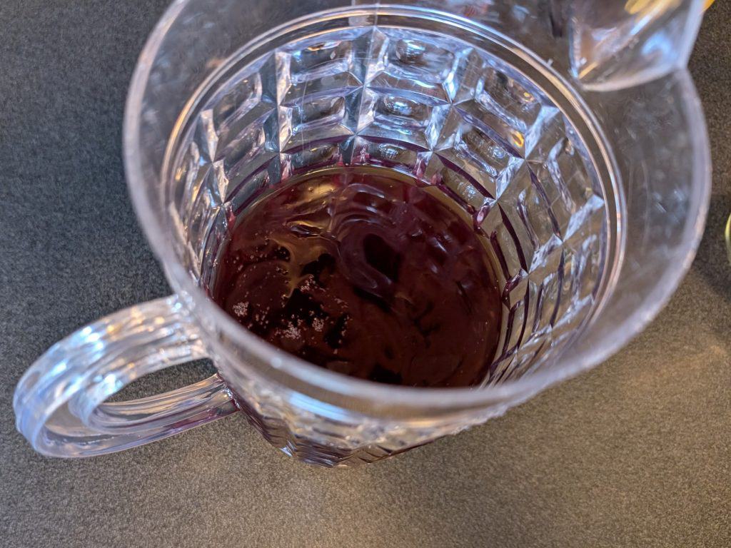 Pisco and Sugar Free Blackberry Syrup combined in a pitcher