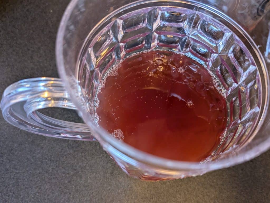 Pisco, Sugar Free Blackberry Syrup, and Lime Juice combined in a pitcher