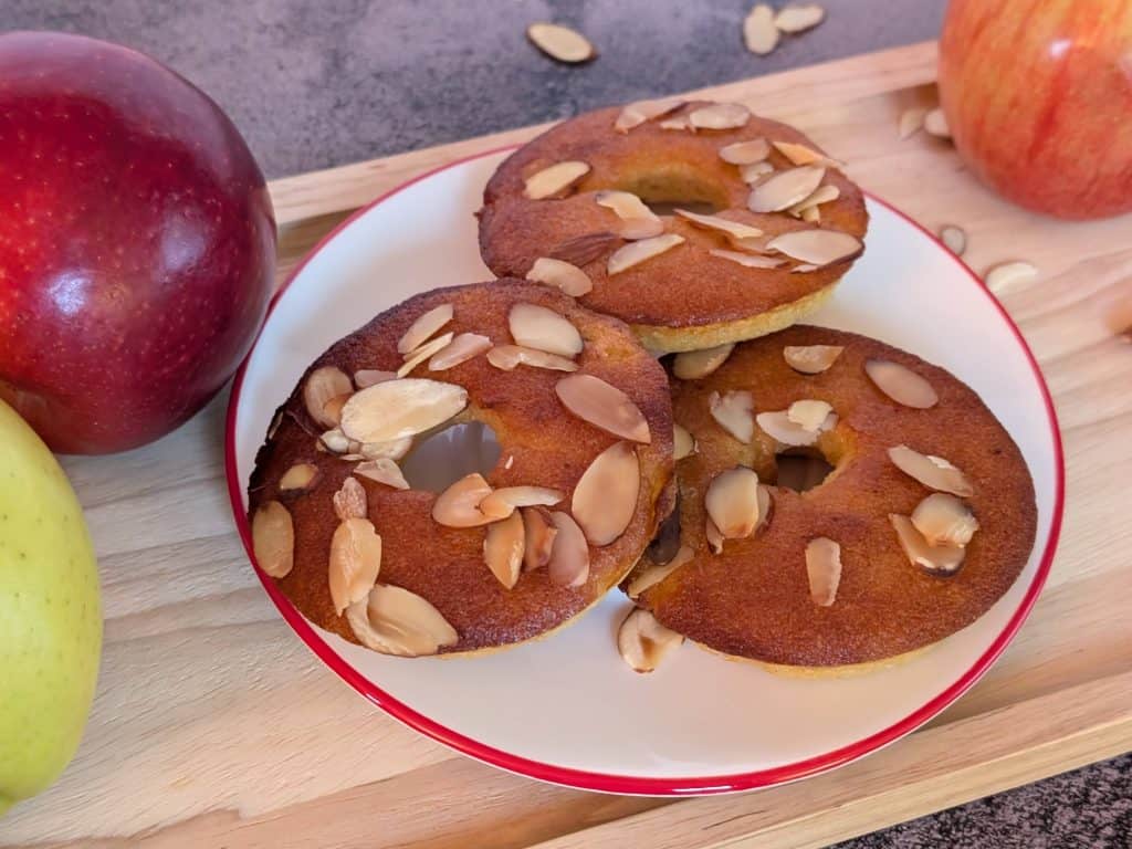 Almond Flour Apple Muffin Rings plated with some apples close up