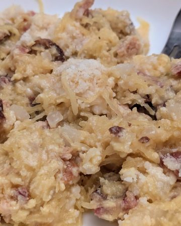 Spaghetti Squash Carbonara plated with a fork