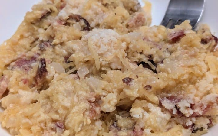 Spaghetti Squash Carbonara plated with a fork