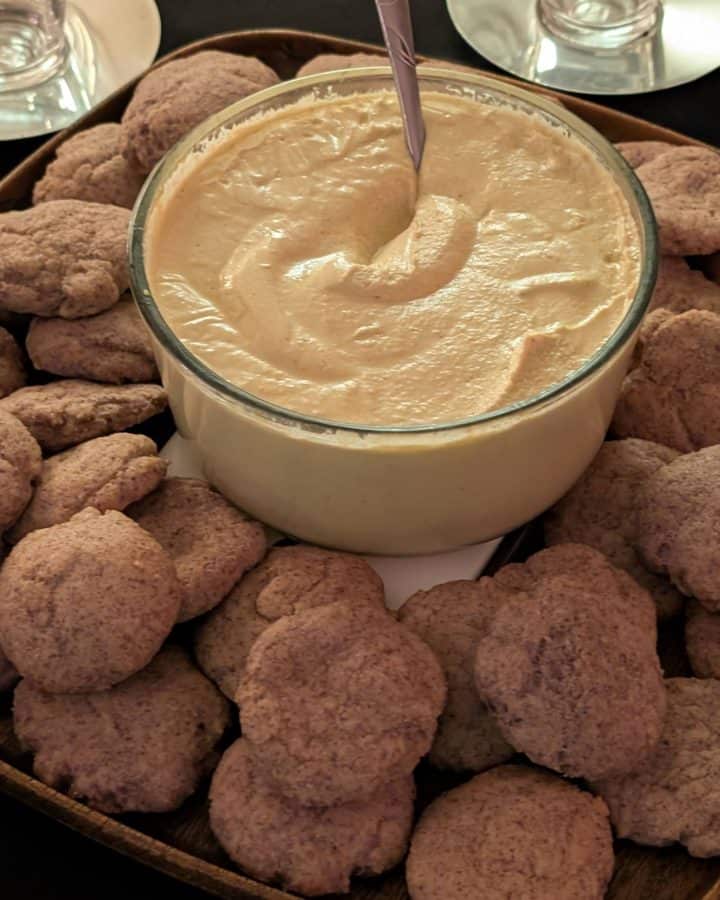 Tangy Curry Cashew Dip in a bowl on a platter of Keto Flatbreads