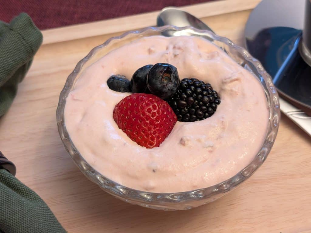 Keto Strawberry Fool plated and garnished with berries - close-up