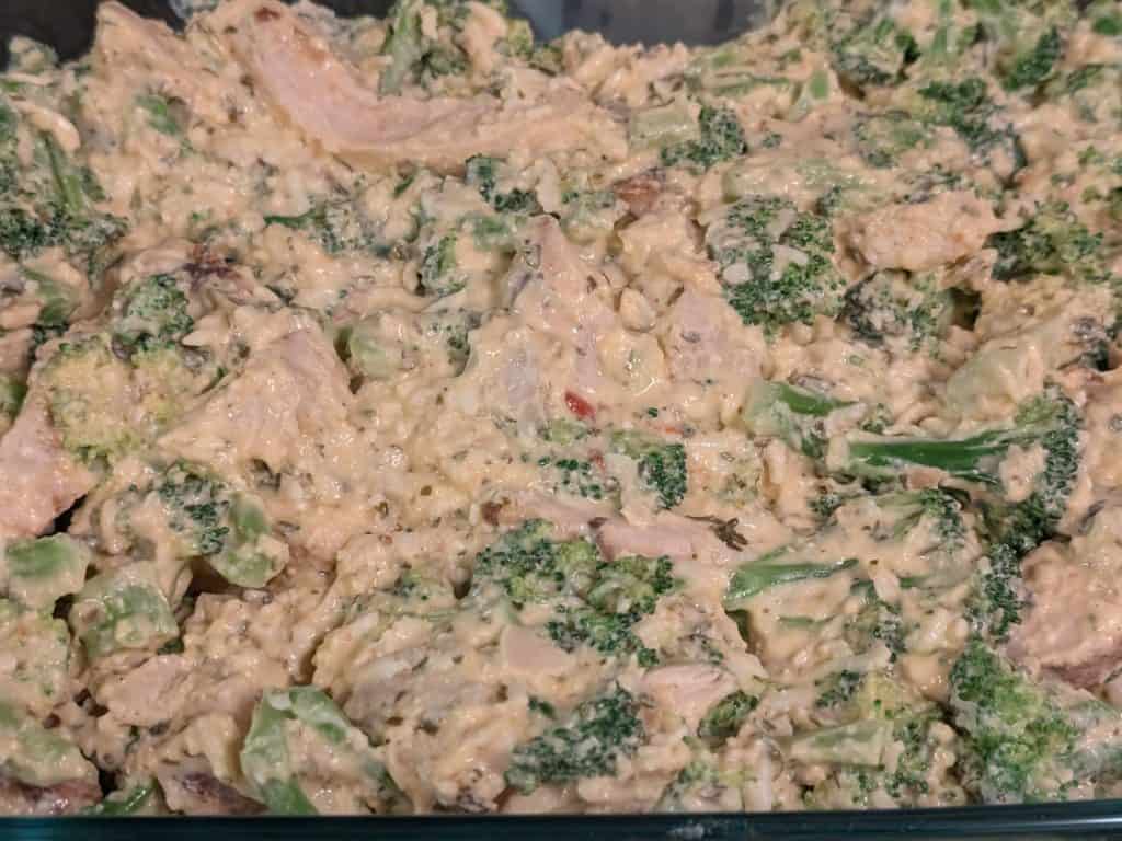 Creamy Chicken Broccoli Casserole in a casserole dish ready to bake