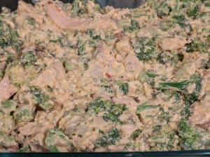 Creamy Chicken Broccoli Casserole in a casserole dish ready to bake