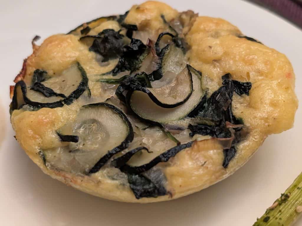 Individual size Zucchini Gouda Bake baked and on a plate for serving
