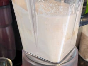 Blending cashews and soaking liquid in a blender