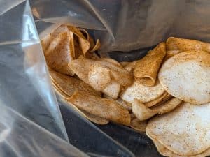 Raw turnip slices seasoned with Curry Kamaal Spice Blend in a zip top bag