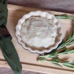 Turnip and Rosemary Purée plated next to sprigs of rosemary close-up