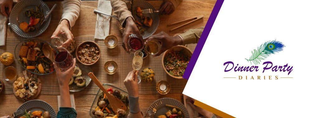 Overhead shot of dinner party table with several guests' hands passing food