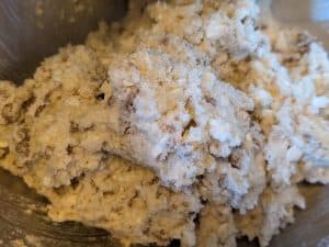 Mixing all ingredients for Lamb and Feta Biscuits
